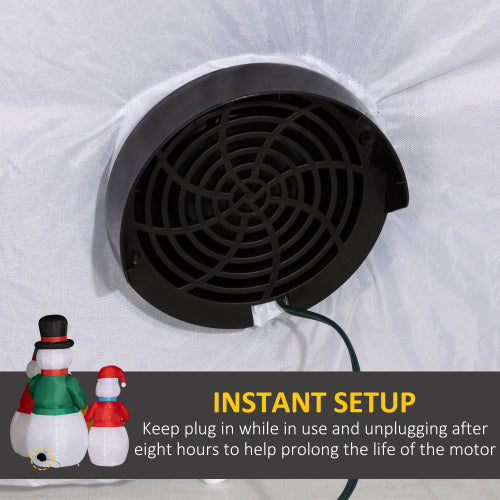 Black fan with snowman decorations on a white background