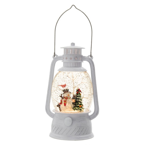White lantern-shaped snow globe with Christmas scene inside on a white background