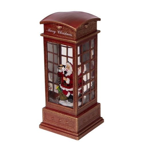 Decorative Christmas village scene with a Santa Claus figure inside a wooden booth.