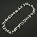 Gardira fully iced-out spiked thorn Cuban link bracelet with punk and hip-hop style, showcasing intricate design and sparkling embellishments.