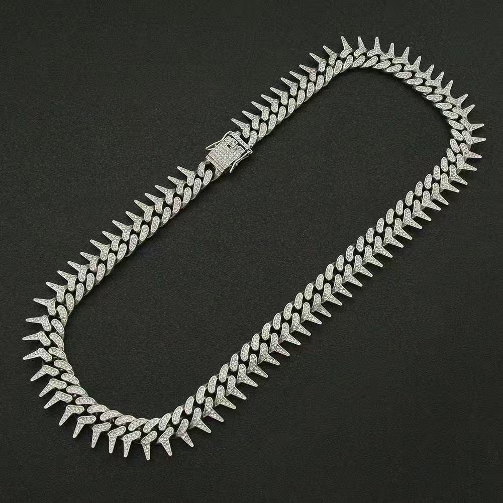 Gardira fully iced-out spiked thorn Cuban link bracelet with punk and hip-hop style, showcasing intricate design and sparkling embellishments.