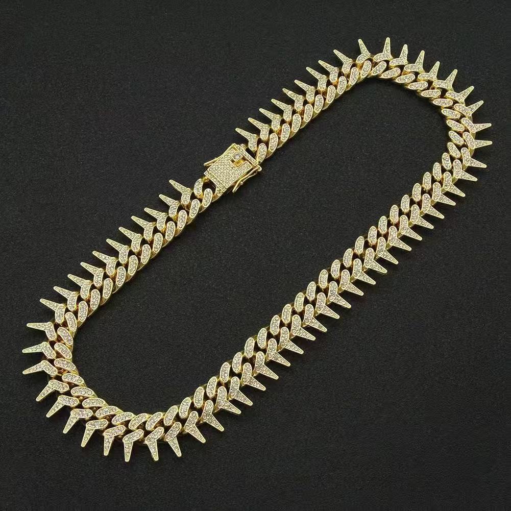 Gardira fully iced-out spiked thorn Cuban link bracelet with sparkling stones, featuring a punk retro hip-hop style design.