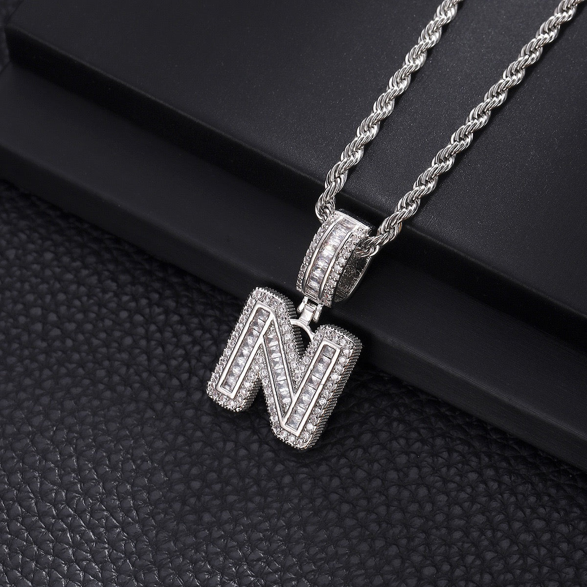 Gold custom iced out initial letter pendant necklace with CZ diamonds by Gardira, featuring a bold alphabet chain for men and women.