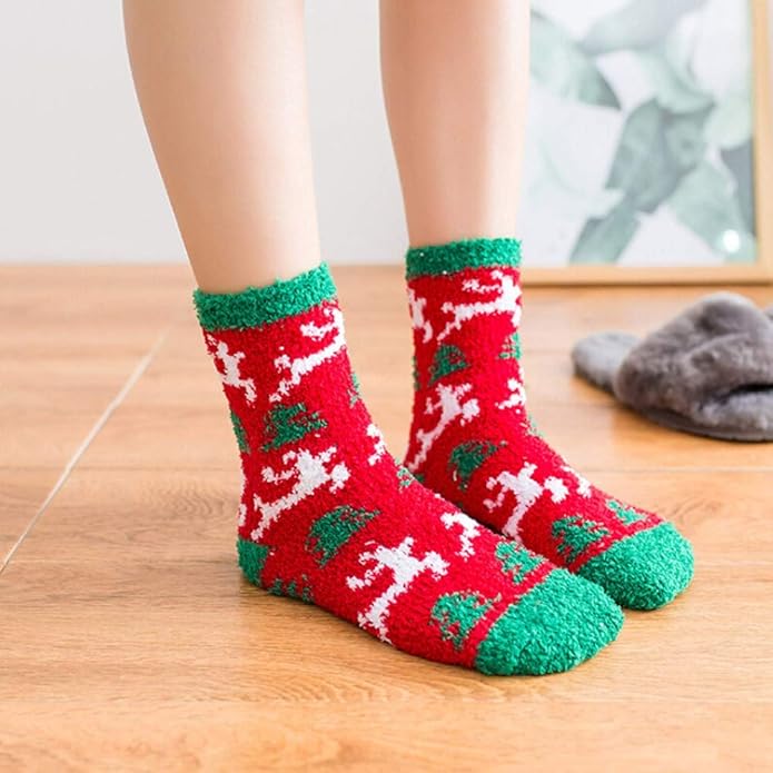 Red and green patterned socks worn on a wooden floor