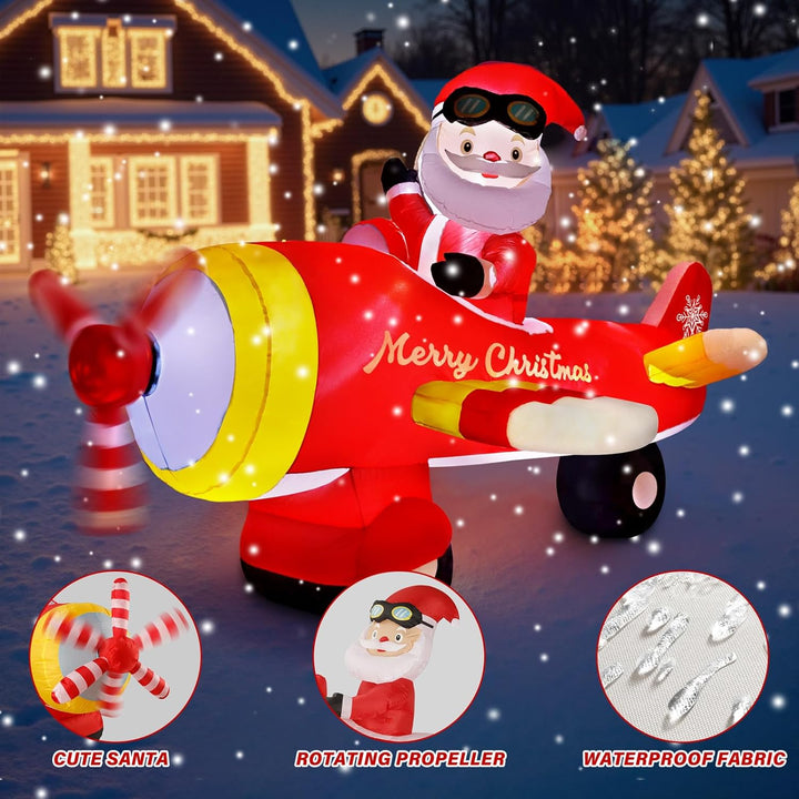 Inflatable Santa Claus on a red airplane with Christmas decorations in the background