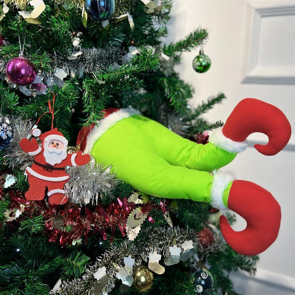 Grinch decorations on a Christmas tree.
