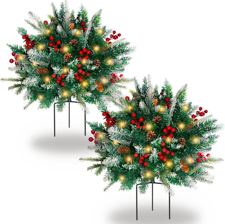 Two Christmas wreaths with lights and berries on a white background