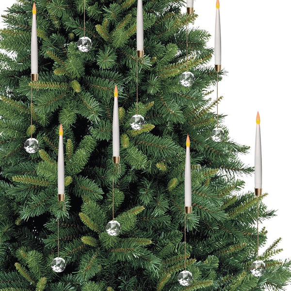 Decorative Christmas tree with hanging candles and crystal decorations