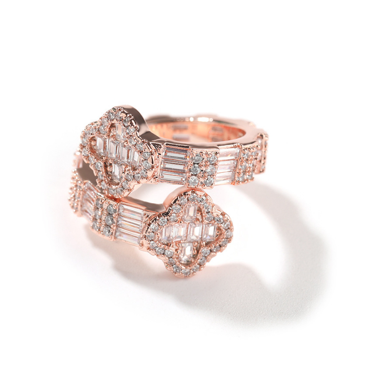 Rose gold ring with diamond accents on a white background