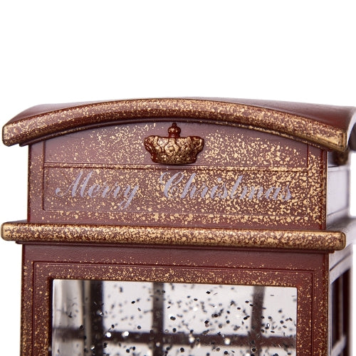 Decorative lantern with 'Merry Christmas' text and gold accents on a white background