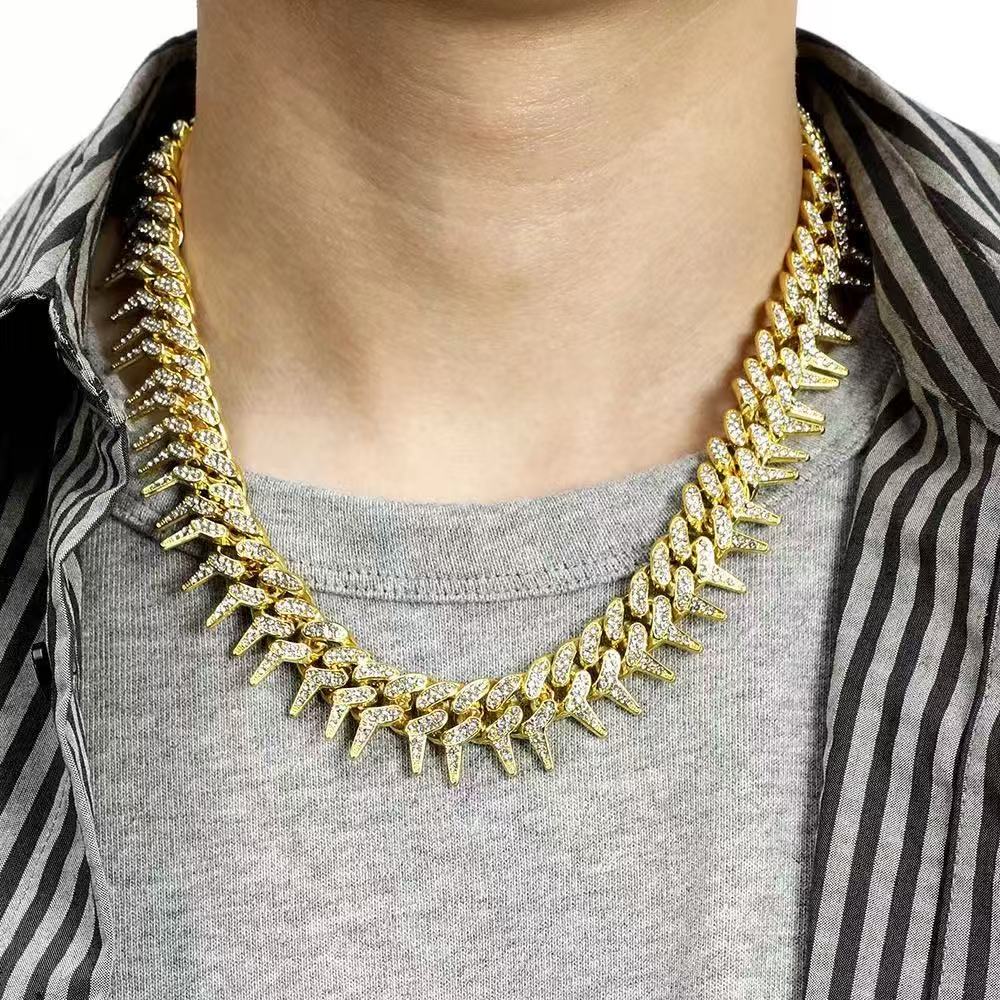 Gardira 19-inch Cuban chain necklace with full diamond rap thorn inlay, showcasing sparkling diamond accents and sleek gold links.
