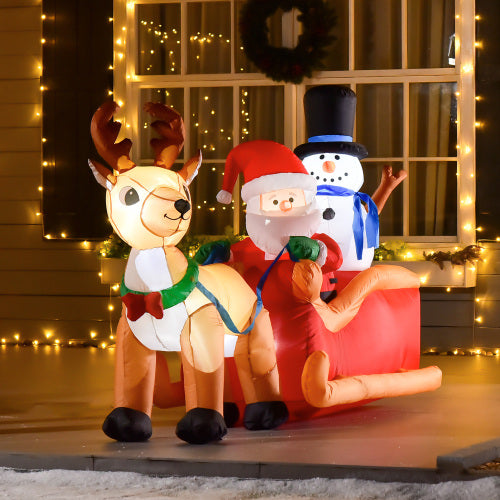 Inflatable Christmas decorations including a reindeer, Santa Claus, and snowman on a porch with lights.