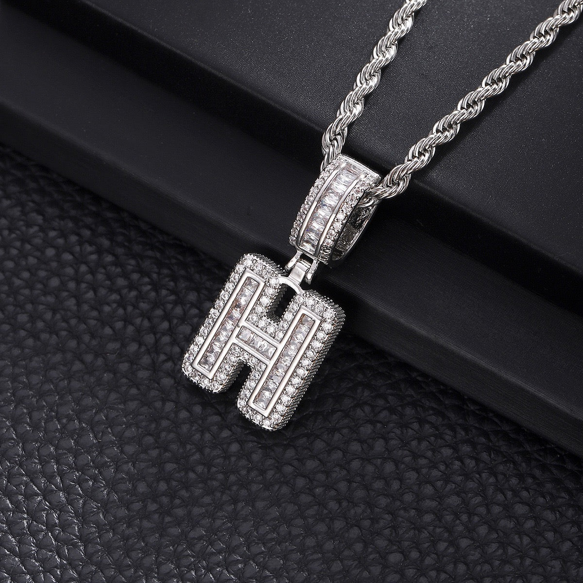 Gold custom iced out initial letter pendant necklace with CZ diamonds by Gardira, featuring a bold alphabet chain for men and women.